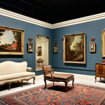 **Image of a museum gallery:** Showcase a variety of furniture styles through history, from antique pieces like a Louis XV chair to modernist designs, emphasizing the evolution and influence of artistic movements like Bauhaus and Memphis.